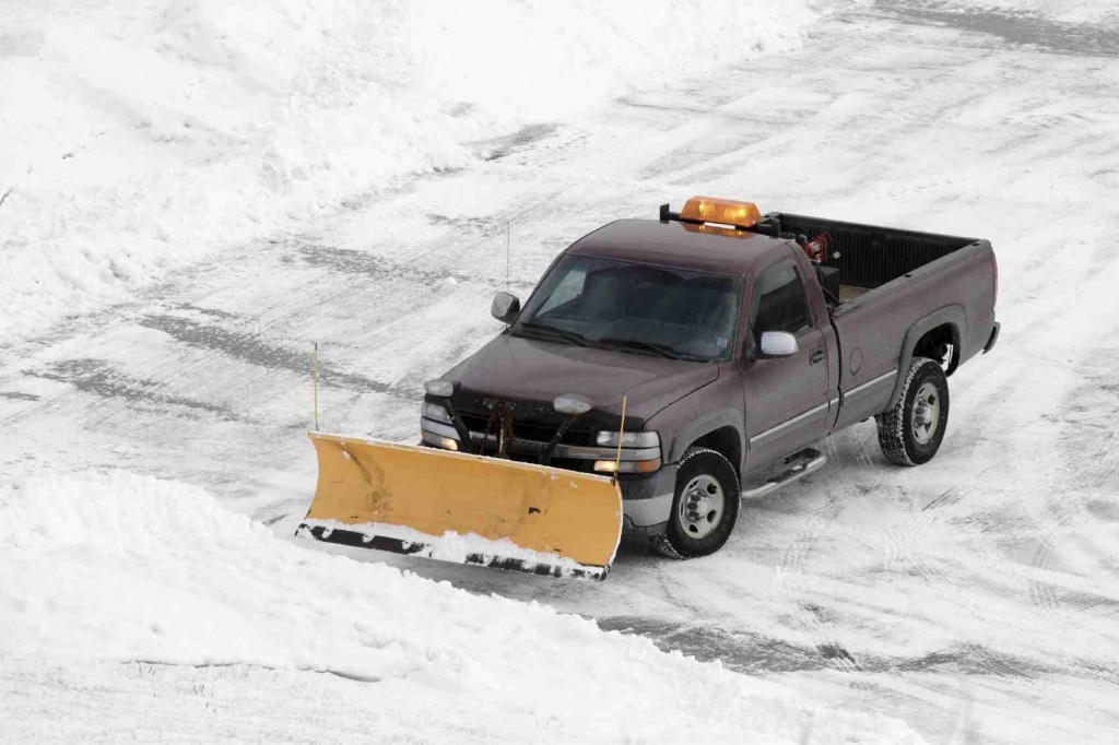 Truck treating a commercial lot